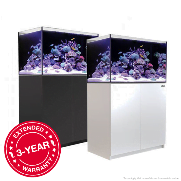 Two fully stocked aquariums with a 3-year extended warranty sticker, showcasing vibrant coral reefs.